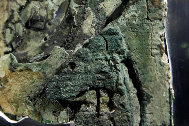 Detail of a fragment of the ancient Antikythera Mechanism displayed at the National Archaeological Museum in Athens, Greece June 9, 2016. REUTERS/Alkis Konstantinidis