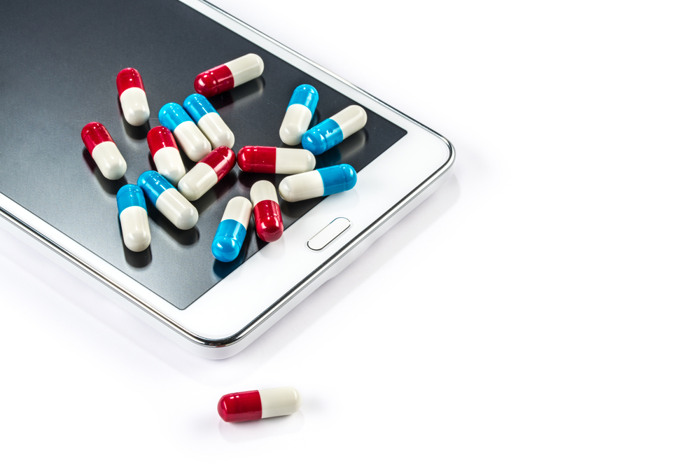 Tablet and pills Capsule on Touch Screen Mobile Phone