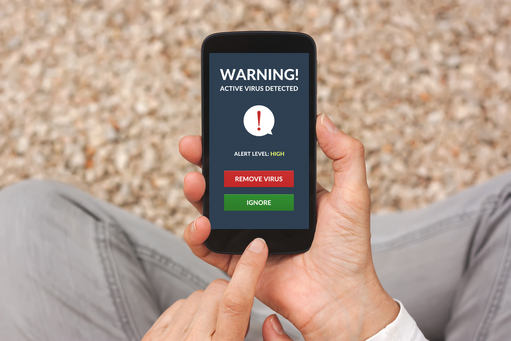 smart phone with virus alert on screen