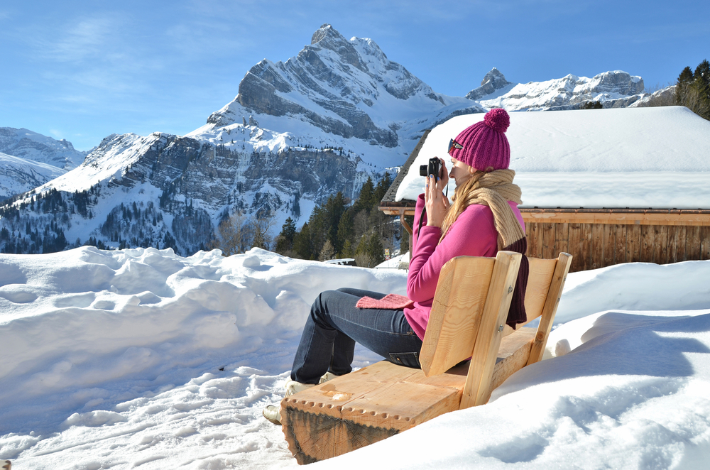 girl-with-a-camera-in-swiss-alps