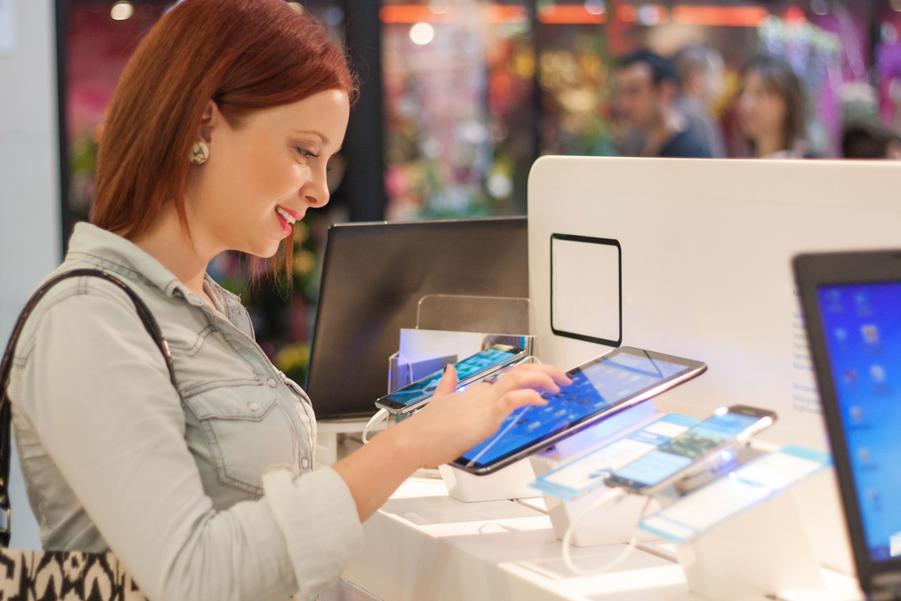 woman-buys-a-digital-tablet