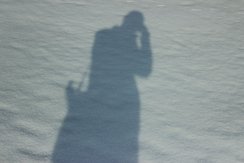 shadow-of-the-man-while-photography-on-the-snow