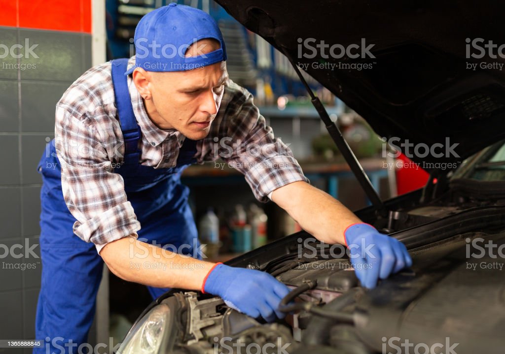 positive-man-car-mechanician-repairing-car-in-auto-repair-service-picture-id1365888845?k=20&m=1365888845&s=612x612&w=0&h=h3mX9qYCGVkFxnvTWWXUGoysQq7zC2g_DMMe9tsPptQ=