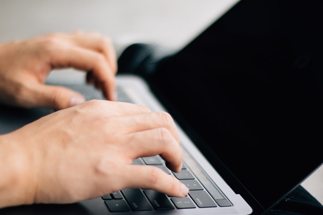 person using black and gray laptop computer