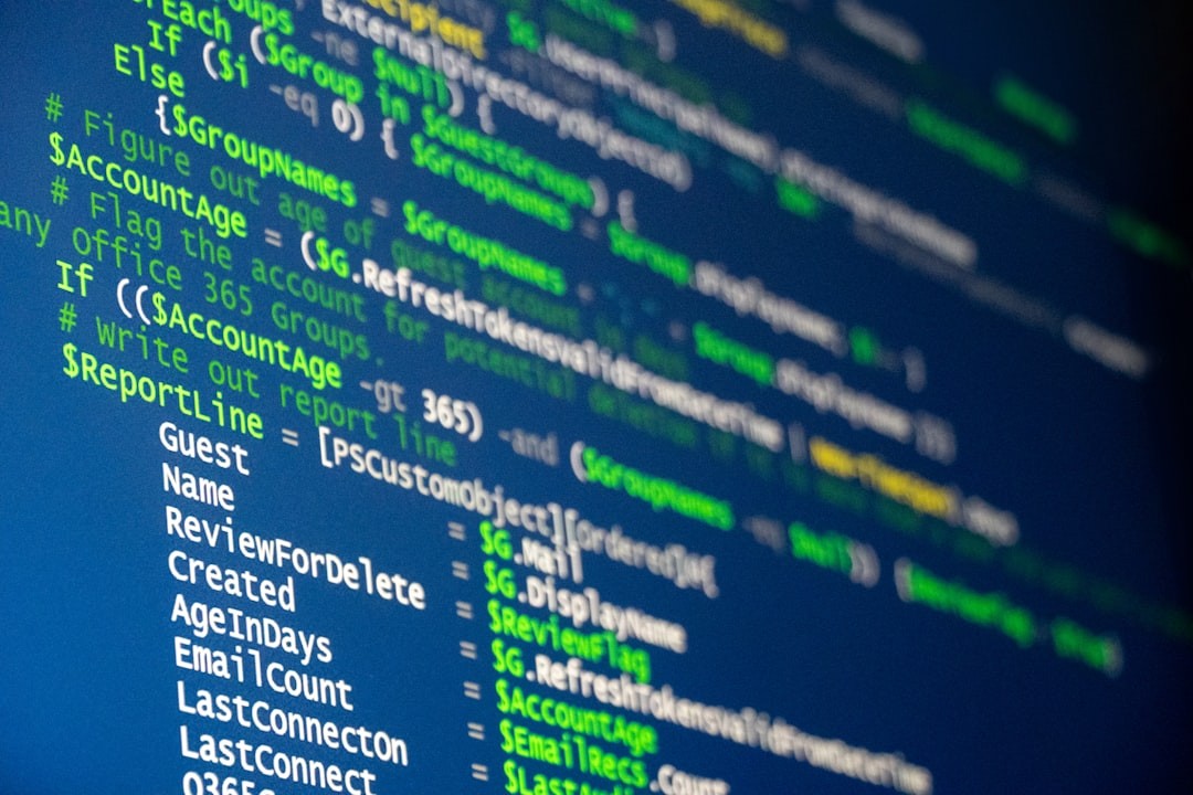 Computer code is displayed on a screen.