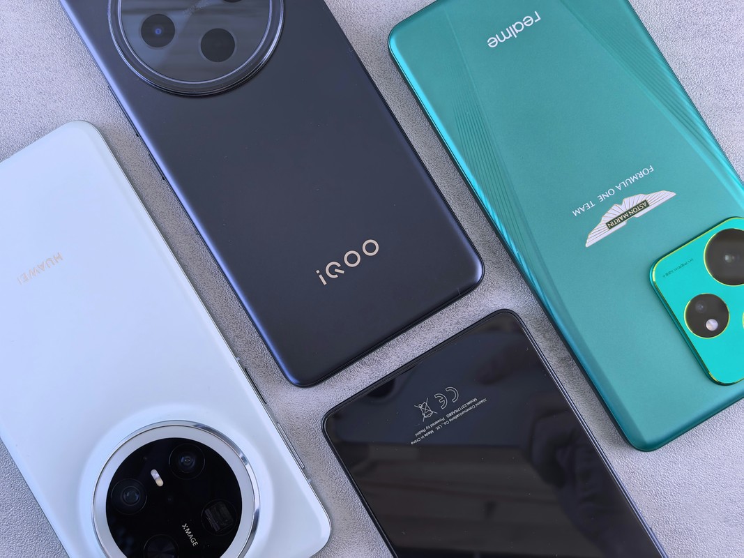 Several modern smartphones are laid out.